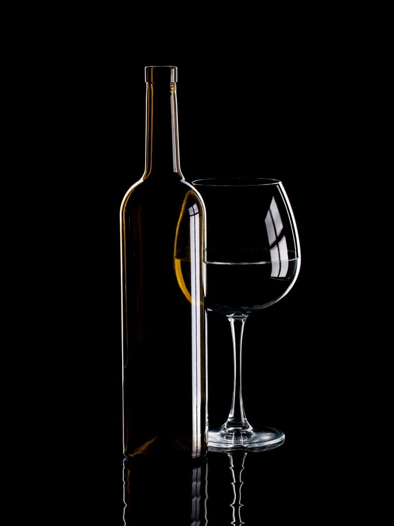 Sommelier tasting bench with a flight of Burgundy bottles and an open notebook
